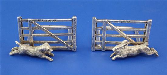 A cased pair of late Victorian novelty silver hunting related menu holders, height 1.25in.